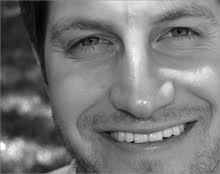 Jeff Riddle, smiling in black and white.